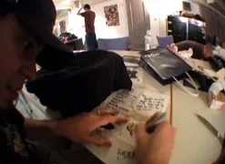 Mike writing the giveaway setlist (from Work In Progress DVD)