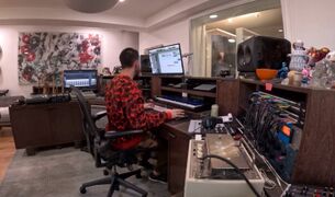 Mike in his home studio recording the song, shown on LPTV
